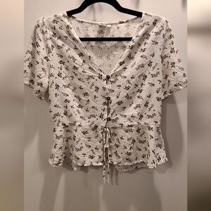 White floral peplum top from Simons, size medium